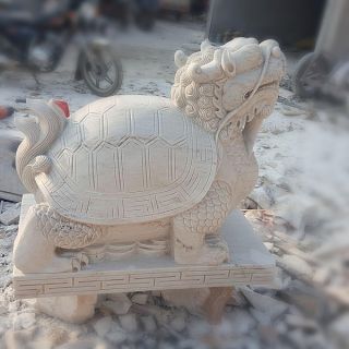 晚霞紅風水龍龜石雕是怎么制作出來的？